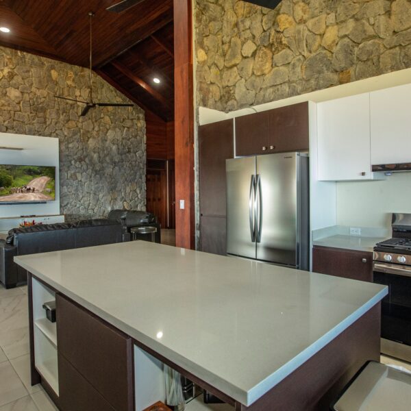 Living room and kitchen at Villa Puerto Escondido all-inclusive in Ocotal, Costa Rica