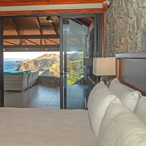 Master bedroom with a view of the ocean at Villa Puerto Escondido all-inclusive in Ocotal, Costa Rica
