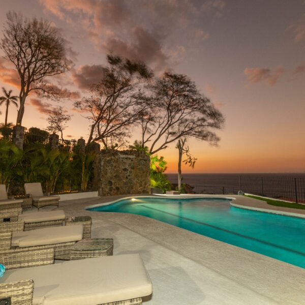 Pool deck at sunset at Villa Puerto Escondido all-inclusive in Ocotal, Costa Rica